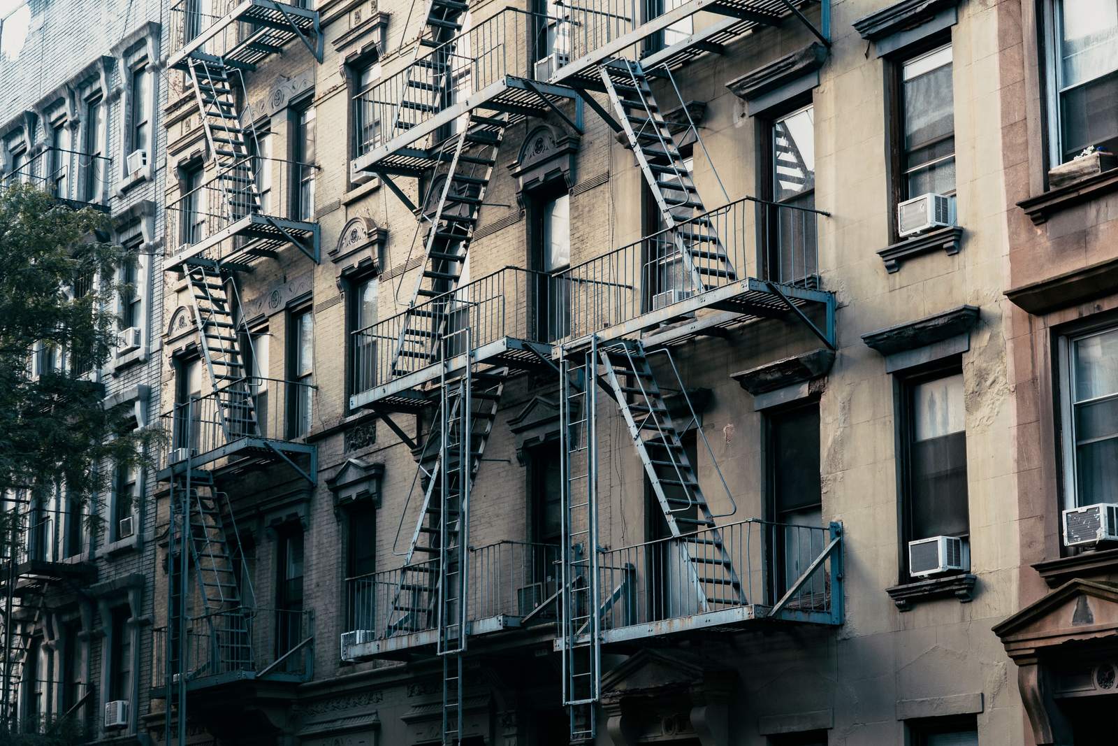 Classic New York apartment buildings with fire escapes